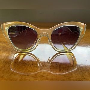 Cat Eye Sunglasses. Clear Frames with Golden Tone Temples